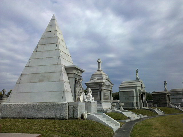Metairie Cemetery includes many interesting sites, including a pyramid shaped tomb and the “Weeping Angel” statue. (Photo via Flickr)