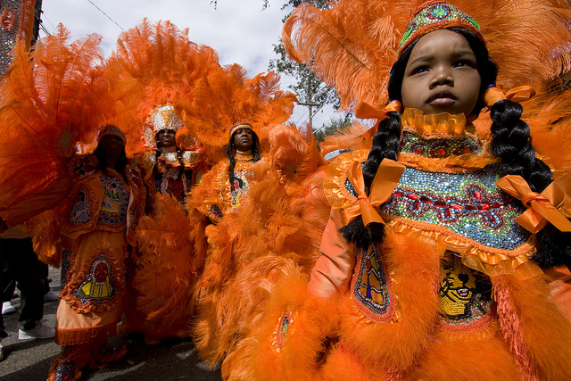 The Mardi Gras Indians traditionally meet and greet other members of their community on Super Sunday. (Photo courtesy Flickr user Derek Bridges)