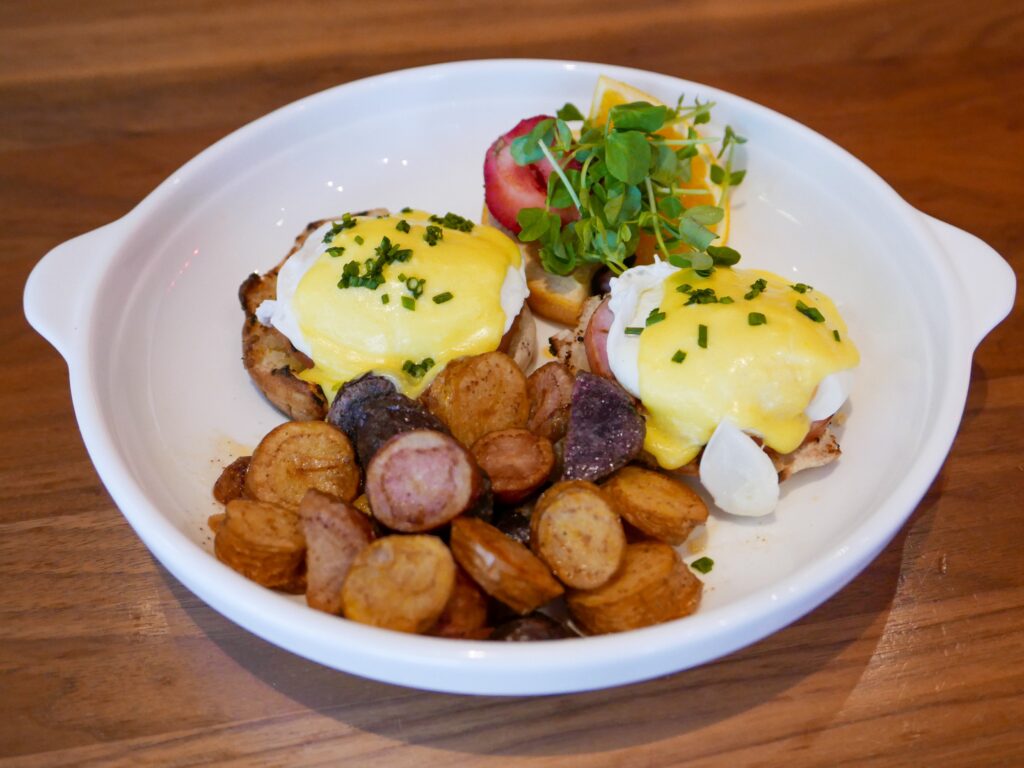 Eggs Benedict with Canadian bacon, poached eggs, while or whole wheat English muffin, Hollandaise sauce.