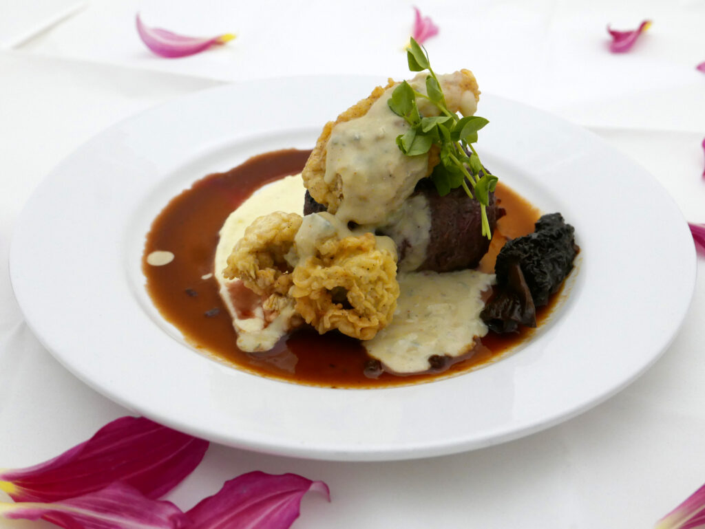 Third course for Criollo's Valentine's dinner menu: Grilled Angus Sirloin with fried Gulf oysters, Morel mushroom farce, whipped russet potato, Maytag blue cream and bordelaise sauce