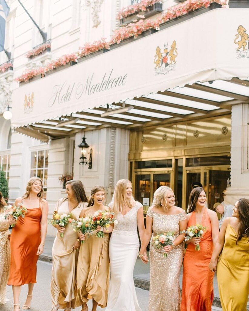 Bride and Bridesmaid on Royal Street outside of Hotel Monteleone