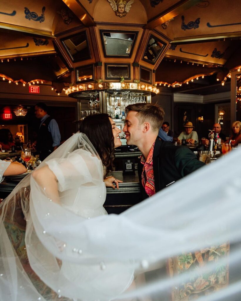 wedded couple seated at the Carousel Bar