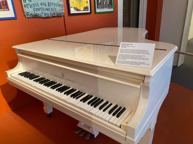 Fats Domino's white Steinway grand piano on display at the New Orleans Jazz Museum