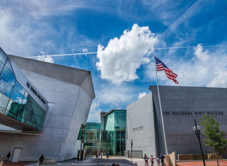 The magestic World War II Museum against a bluebird sky